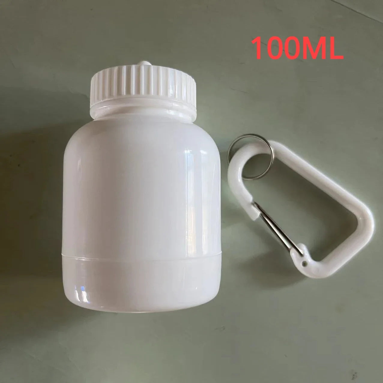 Mini réservoir pour poudres protéinées avec un mousqueton